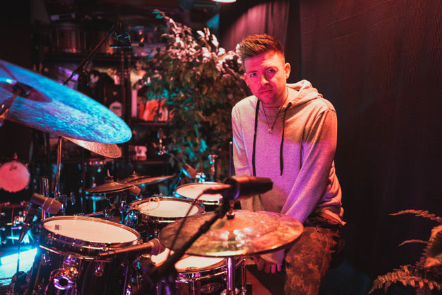 TJ Hartmann is a session drummer and music producer from Dayton, OH. With a background in marching percussion, he now focuses on recording and engineering high quality drum tracks and music production from his home studio.